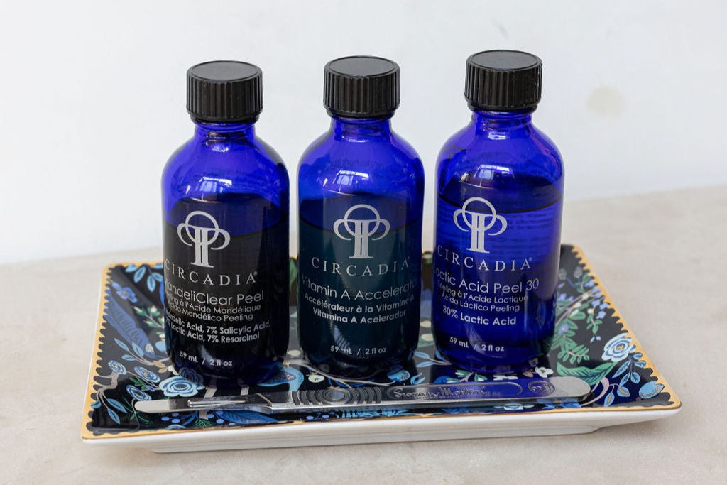 Three blue bottles labeled 'Circadia' on a decorative tray with a white background
